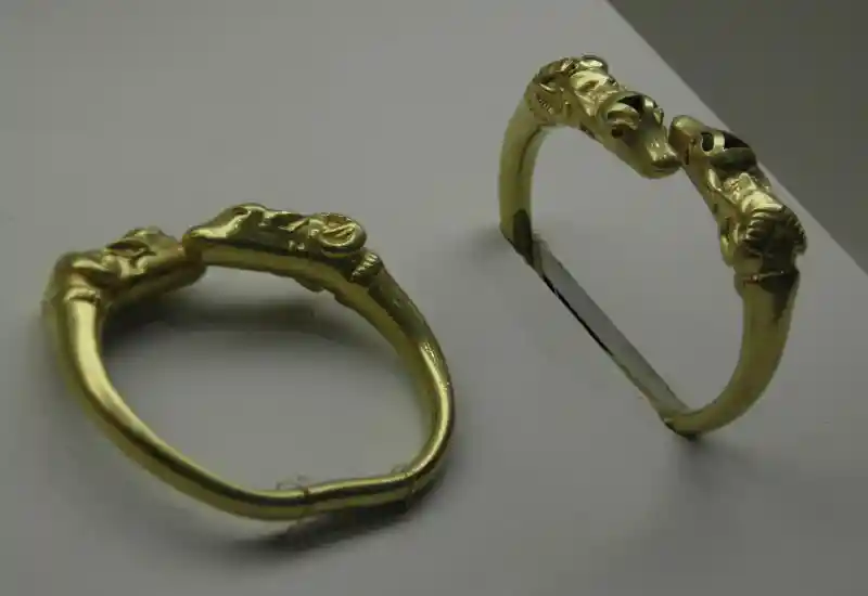 Bracelet with what appears to be mountain goat and cow at the end